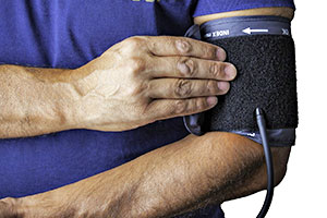 Picture of man checking for high blood pressure