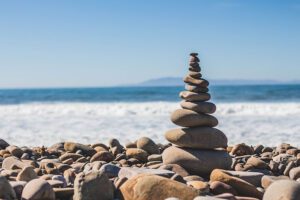 Stones balancing on a rocky seaside shore