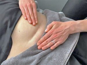 massaging a tummy scar from a c-section operation