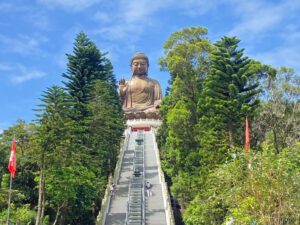 big buddha stature oin a hill ith steps leading up