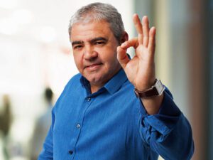 man pictured with ok finger symbol after massage
