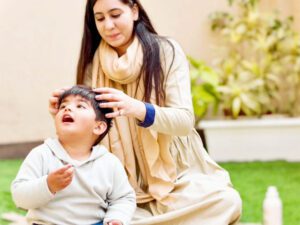 Mother and child improving bond with touch druing head massage